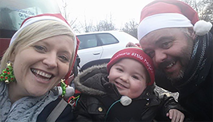 Laura, Tom and Colin wearing Santa hats