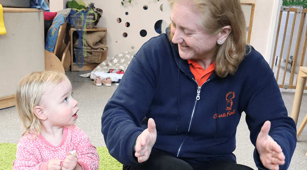 Makaton Tutor Fiona Cockram signing with a young girl