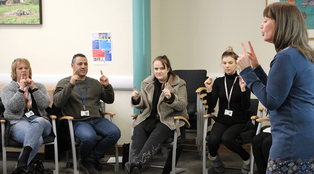Teaching at Derwen College Julie Hawkins teaching Makaton to a class