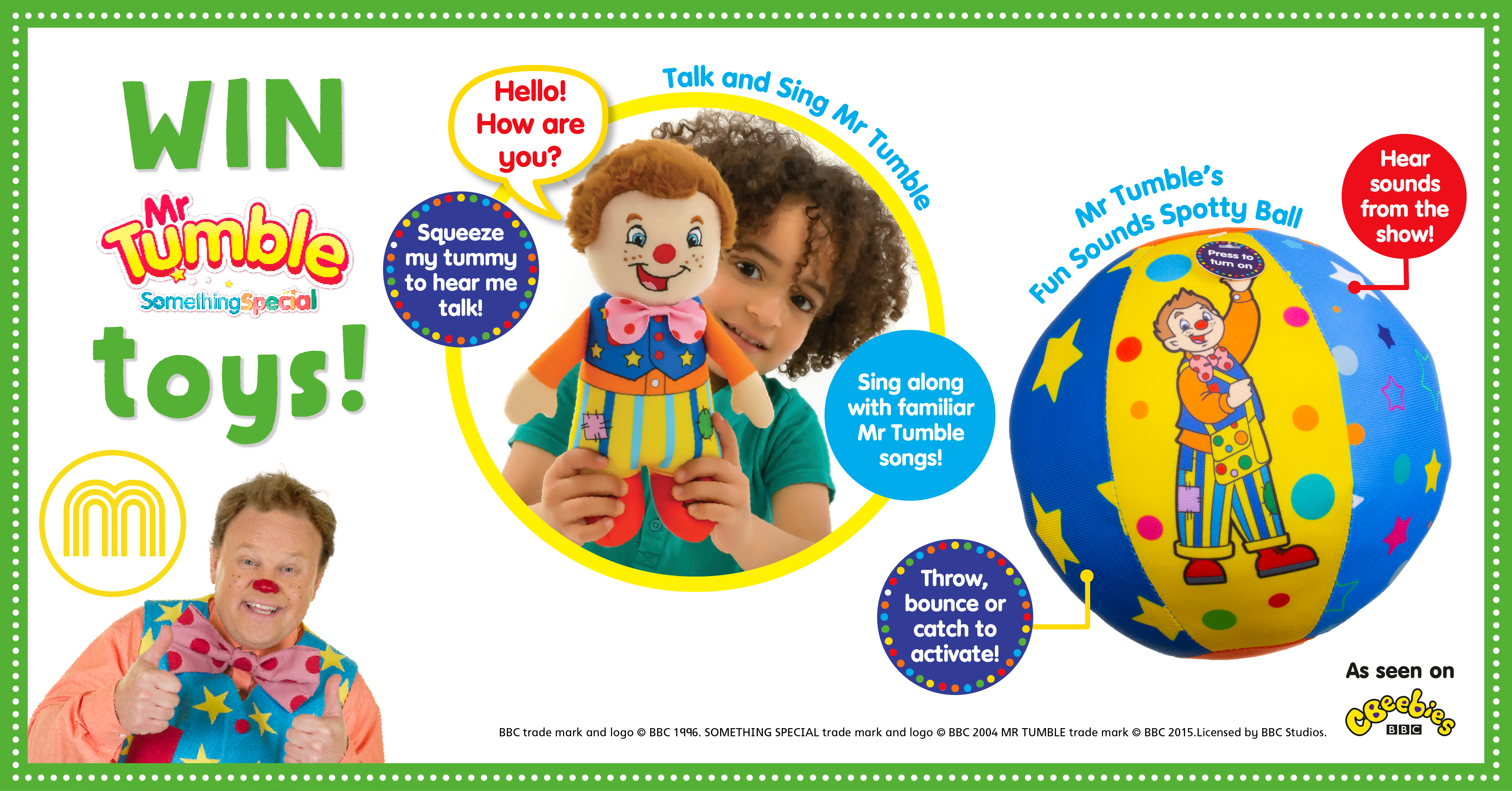 A young child holding a Mr Tumble doll, and a ball with a picture of Mr Tumble on it